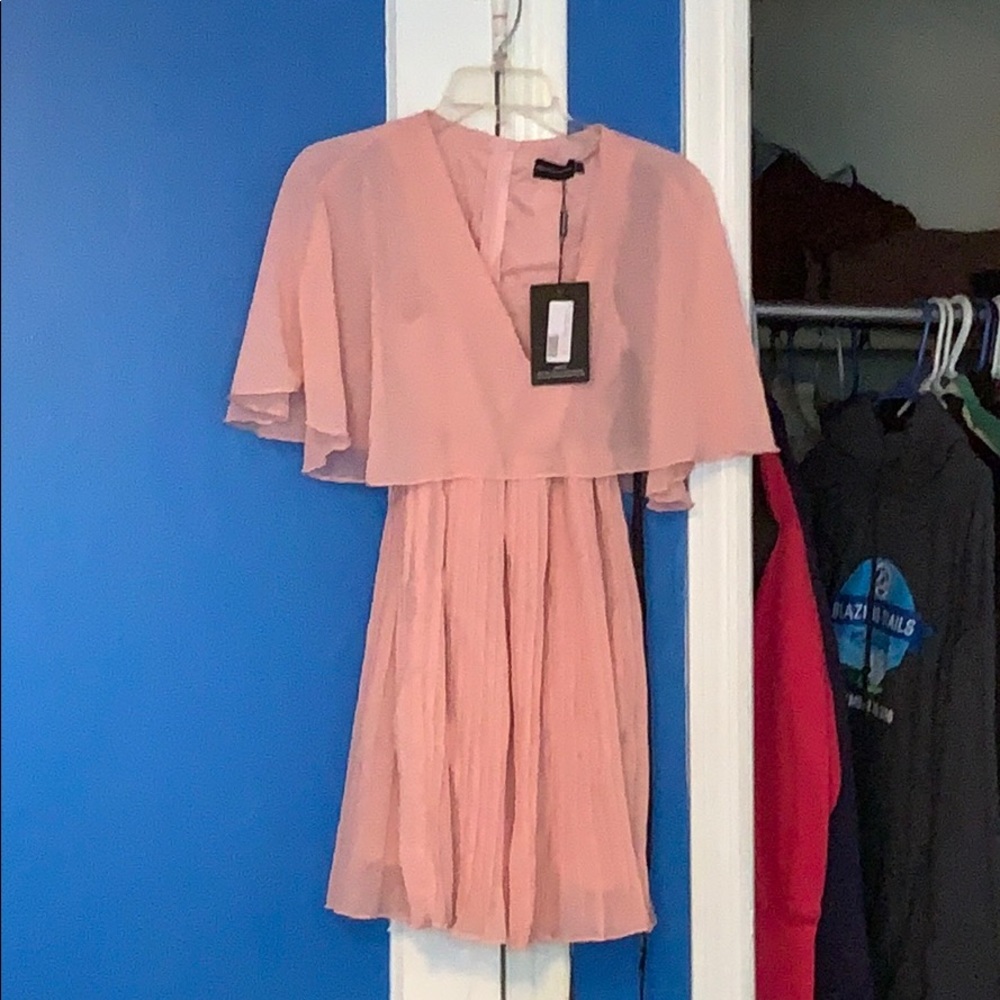 Pink dress with tags never worn before.